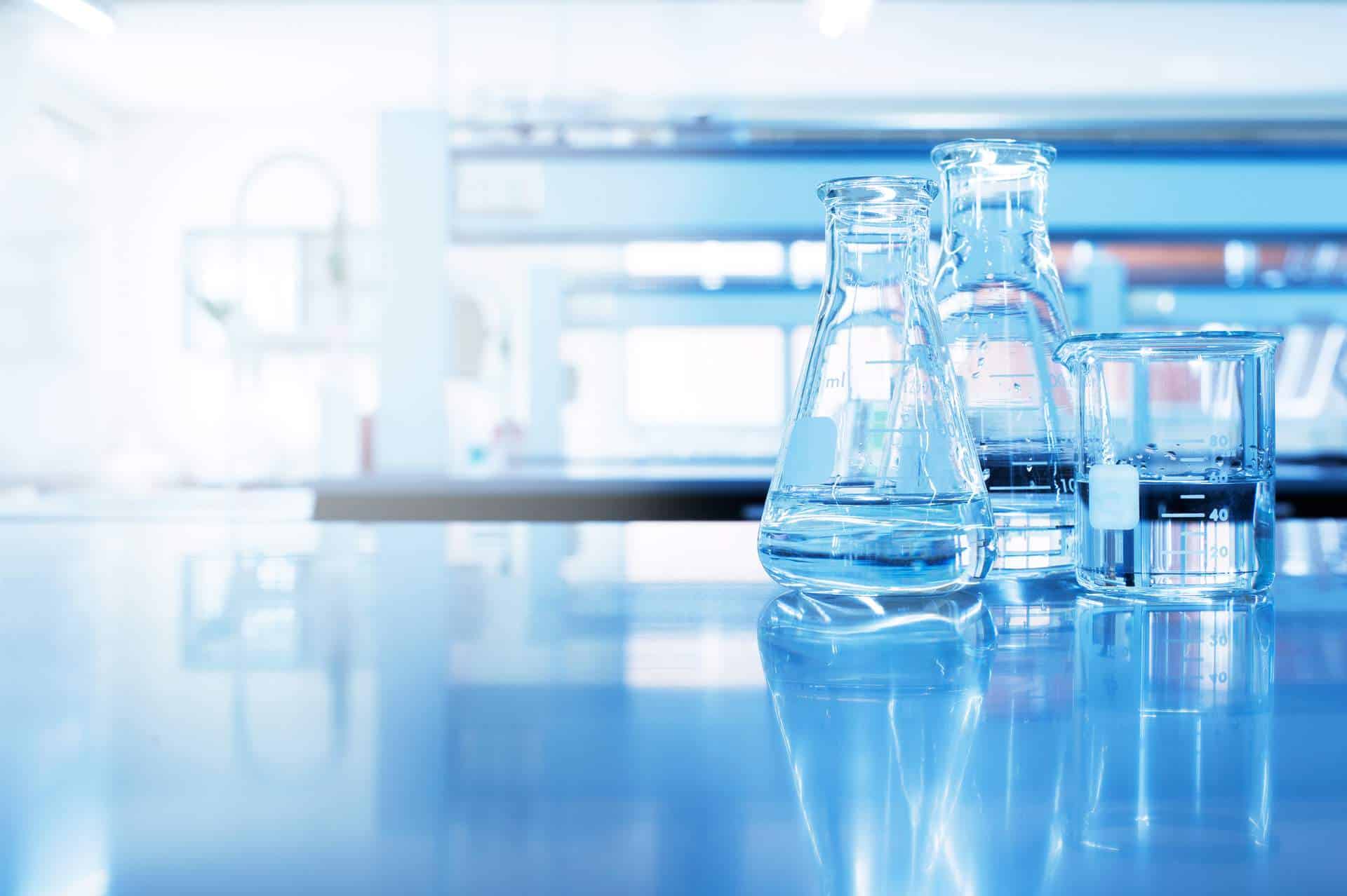 Water In Beaker And Flask Glass In Chemistry Blue Science Laboratory Background